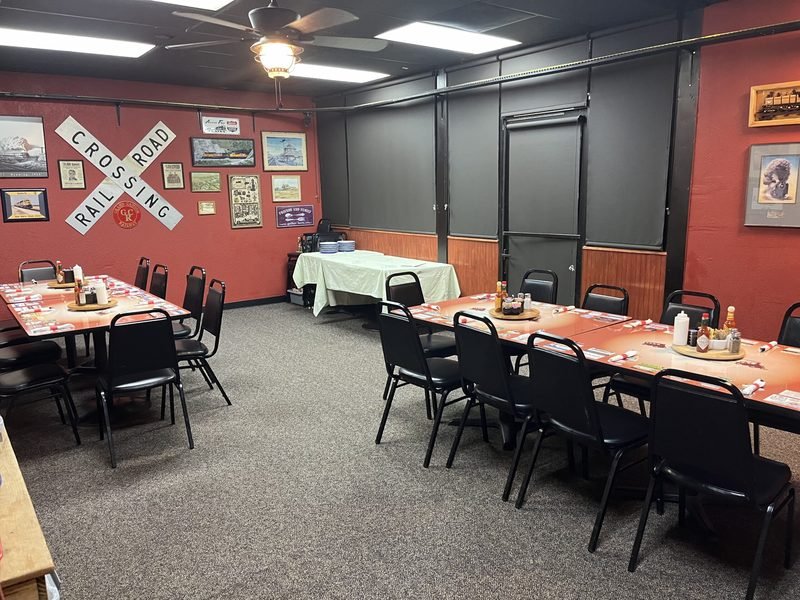 The indoor banquet room set with tables and chairs