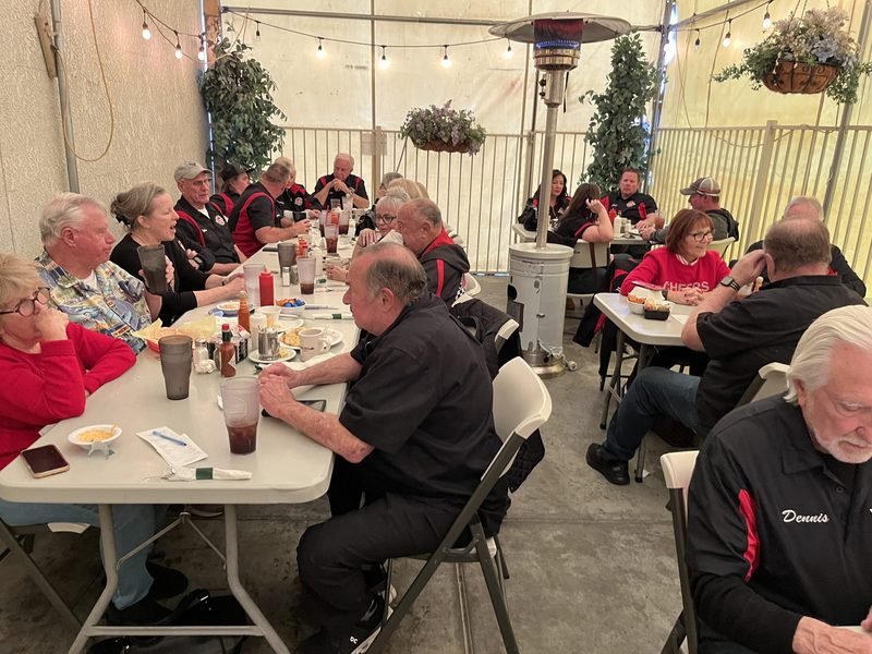 Club members enjoying a meal together on the patio