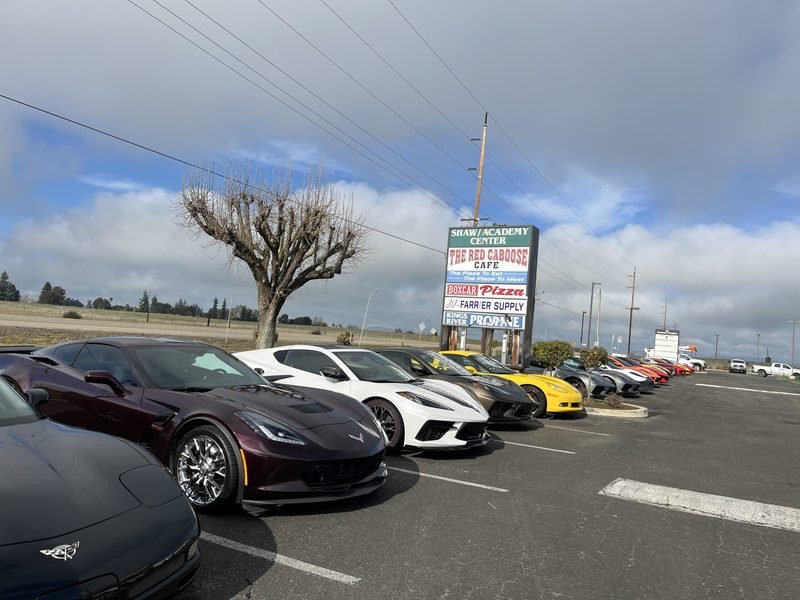 A car club gathering filling the Red Caboose Café parking lot