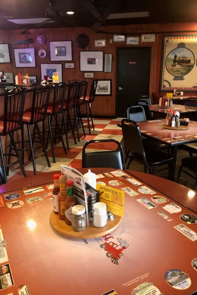 Dining room with bar seating and the railroad mural