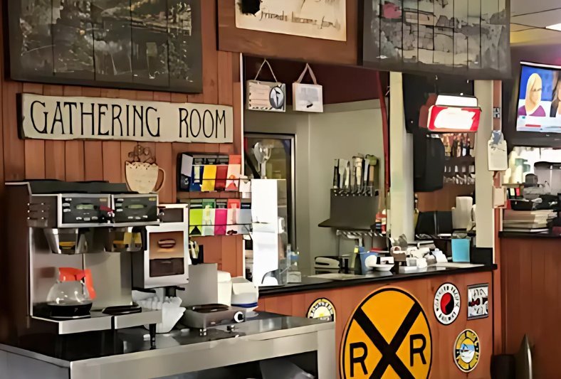 The Gathering Room coffee station with the railroad-crossing sign