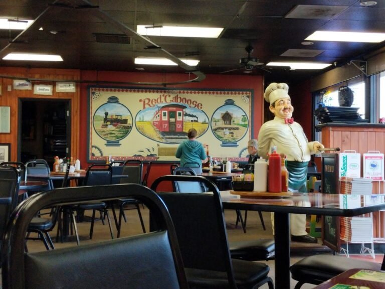The hand-painted Red Caboose railroad mural inside the dining room