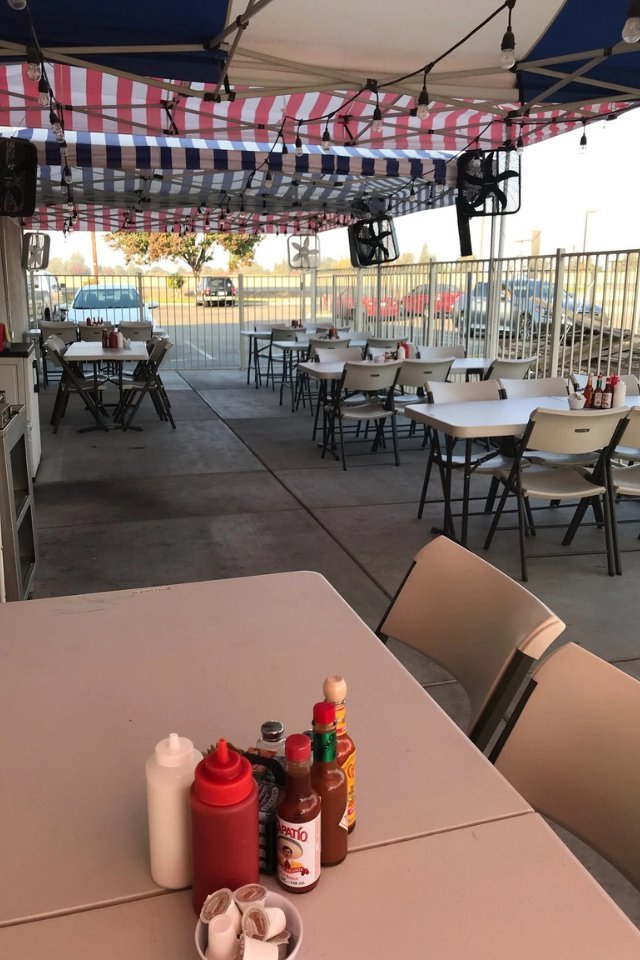The Red Caboose Café covered patio, set up for a gathering